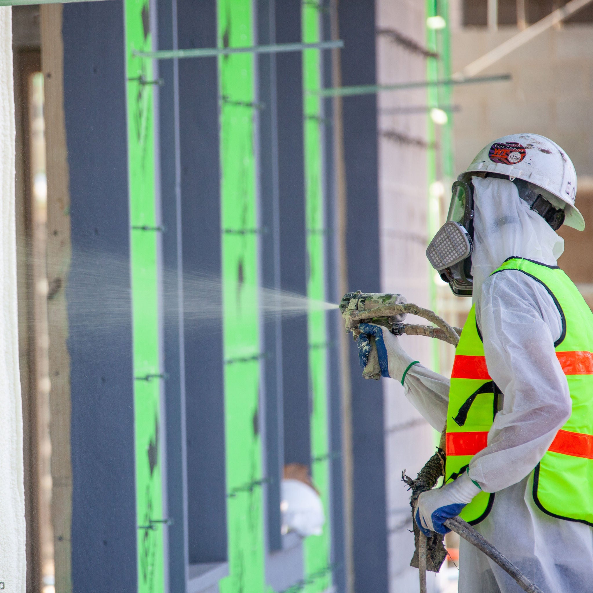 Enverge spray foam being applied to an exterior commercial wall