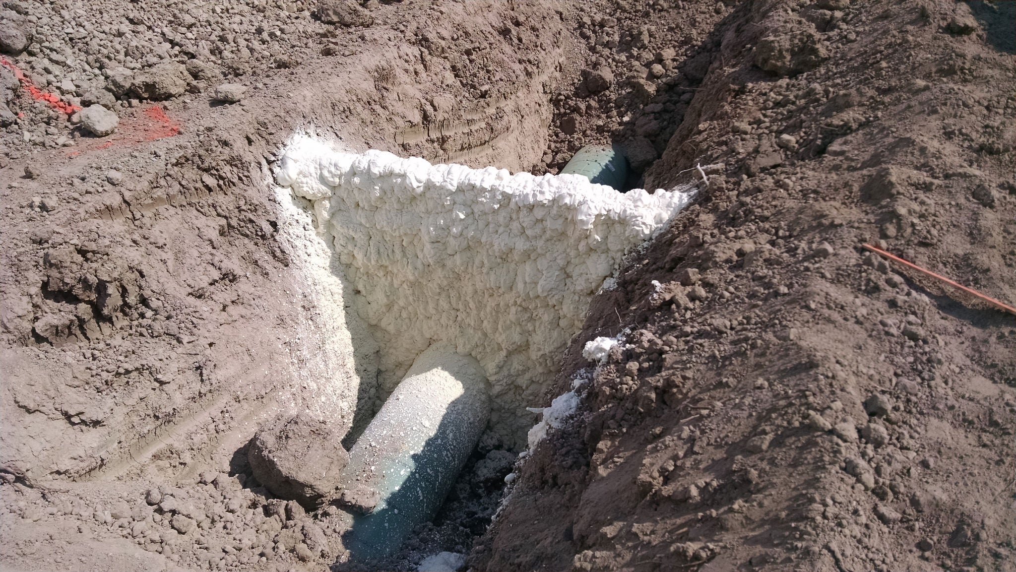 Spray foam installation in trench
